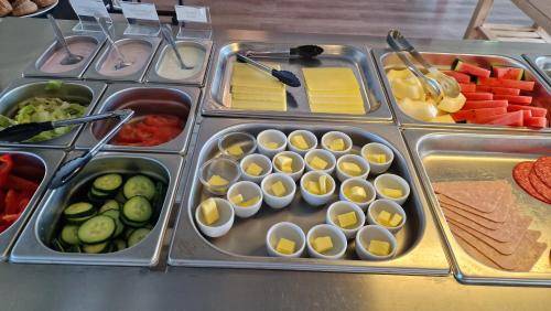 a buffet of food with eggs and vegetables on a table at Hunavellir Guesthouse in Blönduós