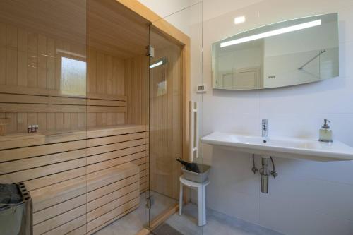 a bathroom with a sink and a shower at Villa K Near The Sea in Premantura