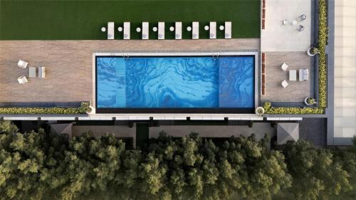 an overhead view of a building with a large screen at Hilton Gurugram Baani City Centre in Gurgaon