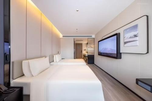 TV a/nebo společenská místnost v ubytování Atour Hotel Tianshui North Road Wanda Chengguan Lanzhou