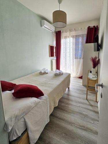 a bedroom with two beds and a window at Villa Versilia in Lido di Camaiore