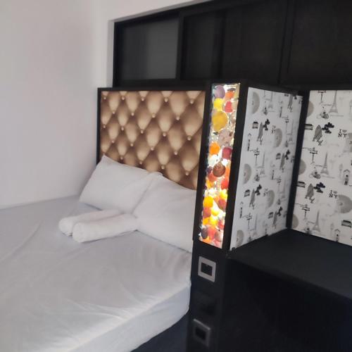 En eller flere senge i et værelse på Loft apartments