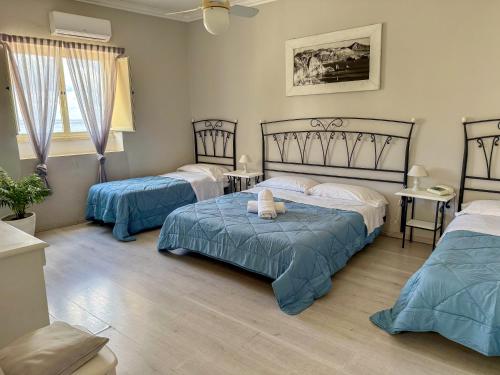 Postel nebo postele na pokoji v ubytování Hotel Odissea