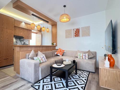 Μια τηλεόραση ή/και κέντρο ψυχαγωγίας στο Urban Nest Agadir - City Center Apartment