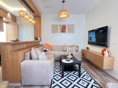 Μια τηλεόραση ή/και κέντρο ψυχαγωγίας στο Urban Nest Agadir - City Center Apartment