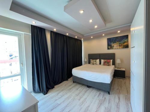 Ένα ή περισσότερα κρεβάτια σε δωμάτιο στο Lara Park Suits Comfort