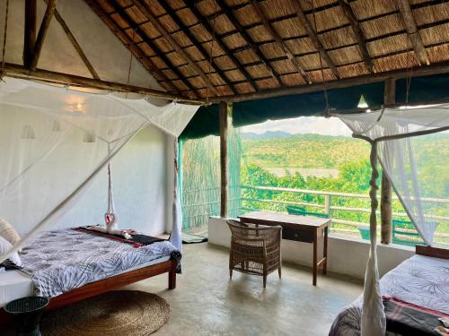 Voodi või voodid majutusasutuse Zua Safari Lodge toas