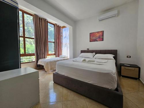 Ένα ή περισσότερα κρεβάτια σε δωμάτιο στο Vila Balili