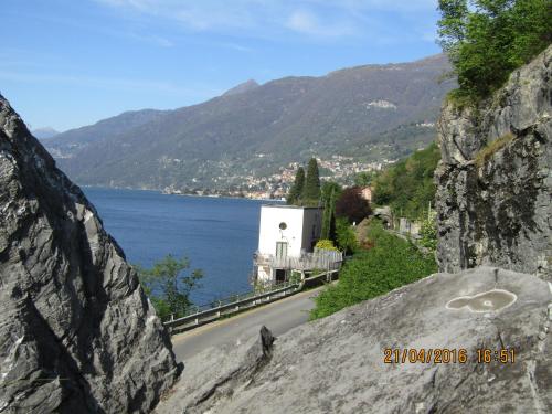 a view of a road and a body of water at La Perla del Lago di Como - CIR O97O67 in Perledo