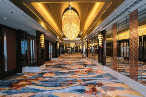 a hallway of a hotel with a large rug at The International Trade City, Yiwu - Marriott Executive Apartments in Yiwu