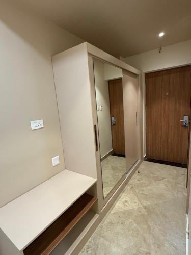 a empty room with a closet and a mirror at JRV Residence in Ambāsamudram
