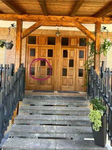 a front door of a building with stairs in front at Near airport Zagreb 2 Netflix, WiFi, Self check in in Velika Gorica