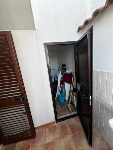 a bathroom with a mirror and a shower stall at Il Villotto in Monte SantʼAngelo