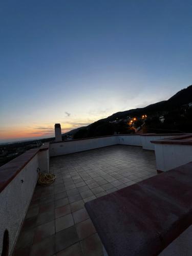 a view from the roof of a building at sunset at Il Villotto in Monte SantʼAngelo