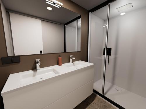 a bathroom with a white sink and a shower at Glamping De Boshoek in Voorthuizen