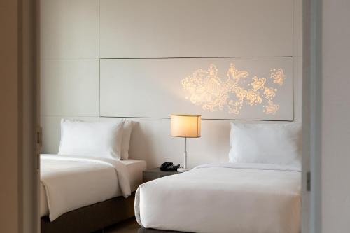 Katil atau katil-katil dalam bilik di Jasmine 59 Hotel