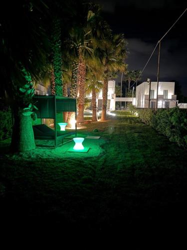 a park at night with lights in the grass at Casa B, Room 5 - mit Pool - at Lagoon - Lo Stagnone Kite Spot - Palm Kite Paradise in Marsala