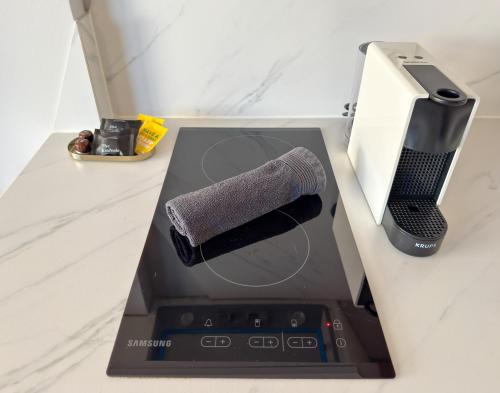 a box with a kitchen appliance on a counter at Luxury Downtown Apartment With Seaview E2 in Thessaloniki