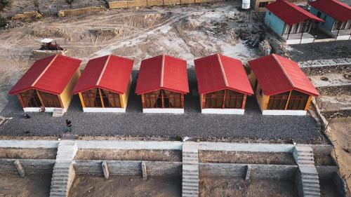 an overhead view of a building with red roofs at The Crescent Resort in Skardu