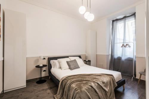 A bed or beds in a room at The Best Rent - Apartment in Testaccio district