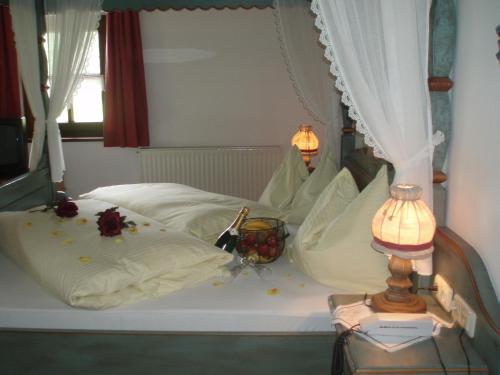 a bedroom with a bed with flowers on it at Naturhotel Hüttenwirt im Grossarltal in Hüttschlag