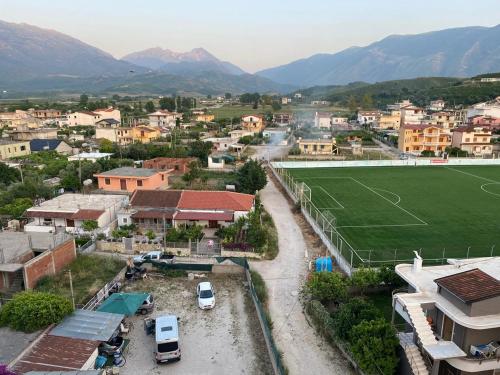 an aerial view of a town with a soccer field at Milaj Apartment in Orikum