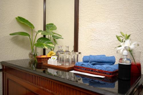 a table with towels and a mirror on it at Taj Deccan in Hyderabad