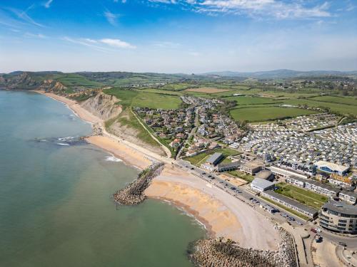 an aerial view of a town next to the beach at NEW Beachfront Apartment slps 4, West Bay, Dorset in West Bay