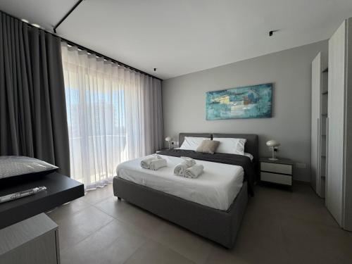 Postel nebo postele na pokoji v ubytování Stays at Celeste - Sea Front Apartments