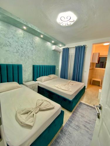 Postel nebo postele na pokoji v ubytování Apartments Lobby