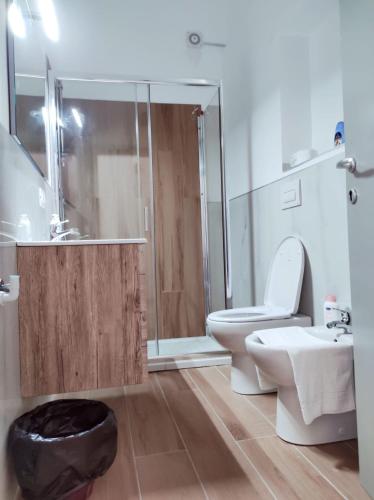 a bathroom with a toilet and a shower and a sink at Affittacamere Ristorante Lo Scudo in Vasto
