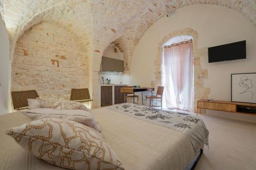 Postel nebo postele na pokoji v ubytování Sunny House Monolocale con Wifi vicino Ostuni