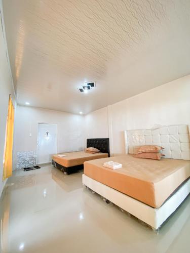 Ένα ή περισσότερα κρεβάτια σε δωμάτιο στο Dang-Dang Na Bungalows