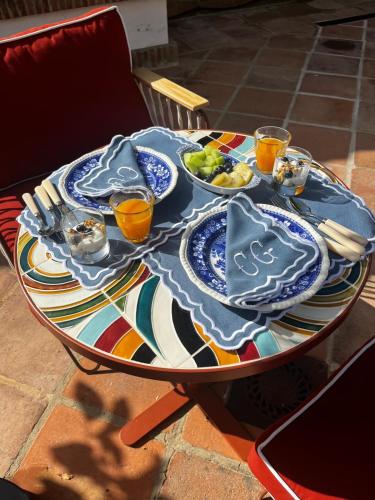 a table with plates and bowls of food on it at Cortijo Genesis in Gaucín