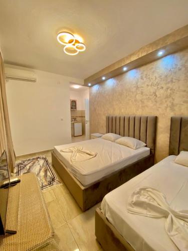 Postel nebo postele na pokoji v ubytování Apartments Lobby