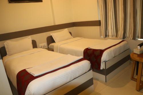 Una cama o camas en una habitación de Hotel Kamakshya Pvt Ltd