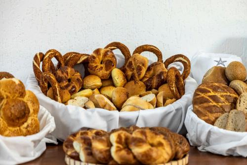 a group of baskets filled with different types of bread at Costa Maya Bodrum in Bodrum City