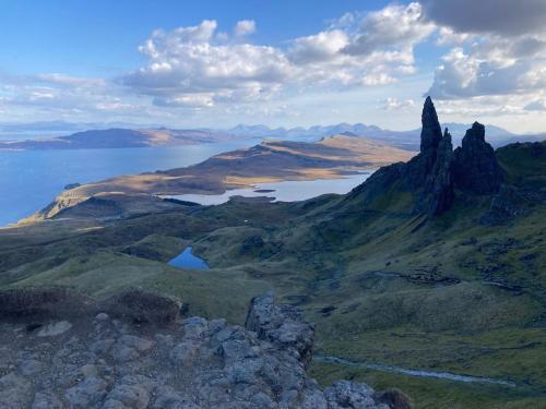 a view of a mountain with rocks and water at The Captain's Place - Isle of Skye in Bracadale