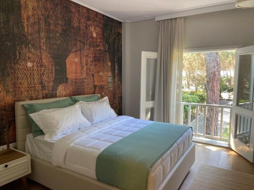 Llit o llits en una habitació de Villa Pinea Mare