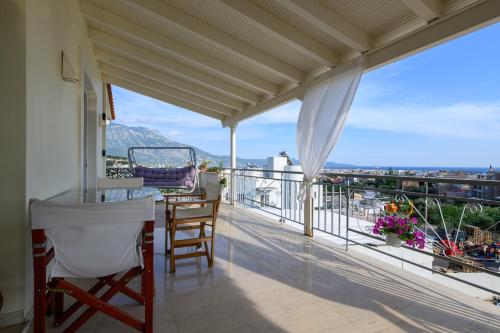 a balcony with a view of a city at Kalamata Panorama Villa in Kalamata