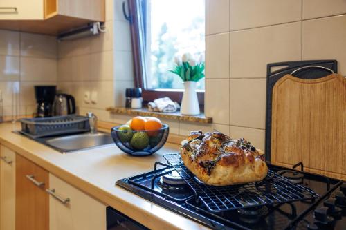 a pastry is sitting on a stove in a kitchen at Villa Ivona with pool in Poljica