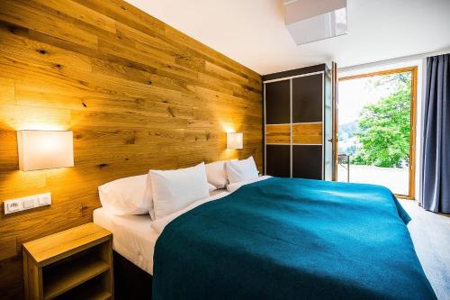 Postel nebo postele na pokoji v ubytování Amenity Hotel & Resort Špindlerův Mlýn
