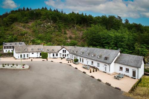 an aerial view of a building with a parking lot at Äuchen am Rosenthal in Monschau
