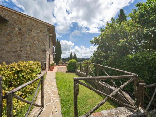 a path leading to a building with a wooden gate at Holiday Home La Corte by Interhome in Lucolena in Chianti