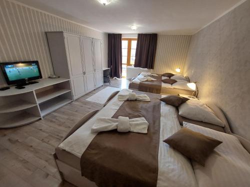 Postel nebo postele na pokoji v ubytování Hotel SEVERKA