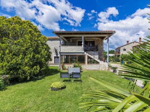 a view of a house with a yard at Holiday Home Pinezici-1 by Interhome in Marčana