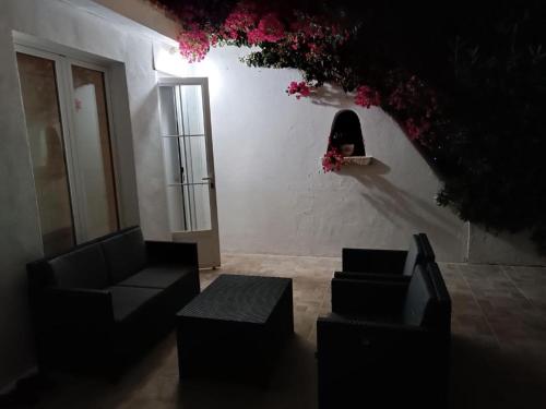 a room with a person looking out of a window at Chalet calan Bosch Menorca in Cala'n Bosch
