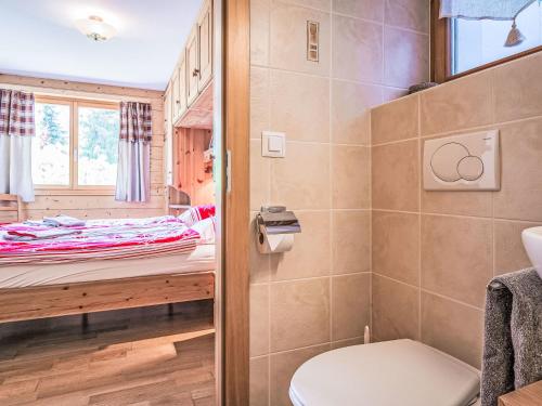 a bathroom with a toilet and a shower at Apartment Rhodos B101 by Interhome in Ovronnaz