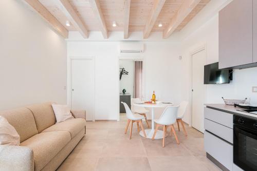 a living room with a couch and a table at Eleia Mirea in Monopoli