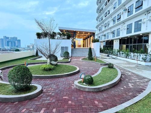a brick walkway in front of a building at J Tower Residences in Mandaue City